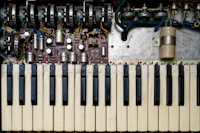 A close up of a keyboard with many knobs