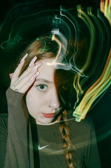 A woman with her hands on her head