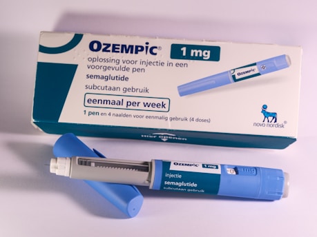 A tube of oezpic sitting next to a tube of oezpic