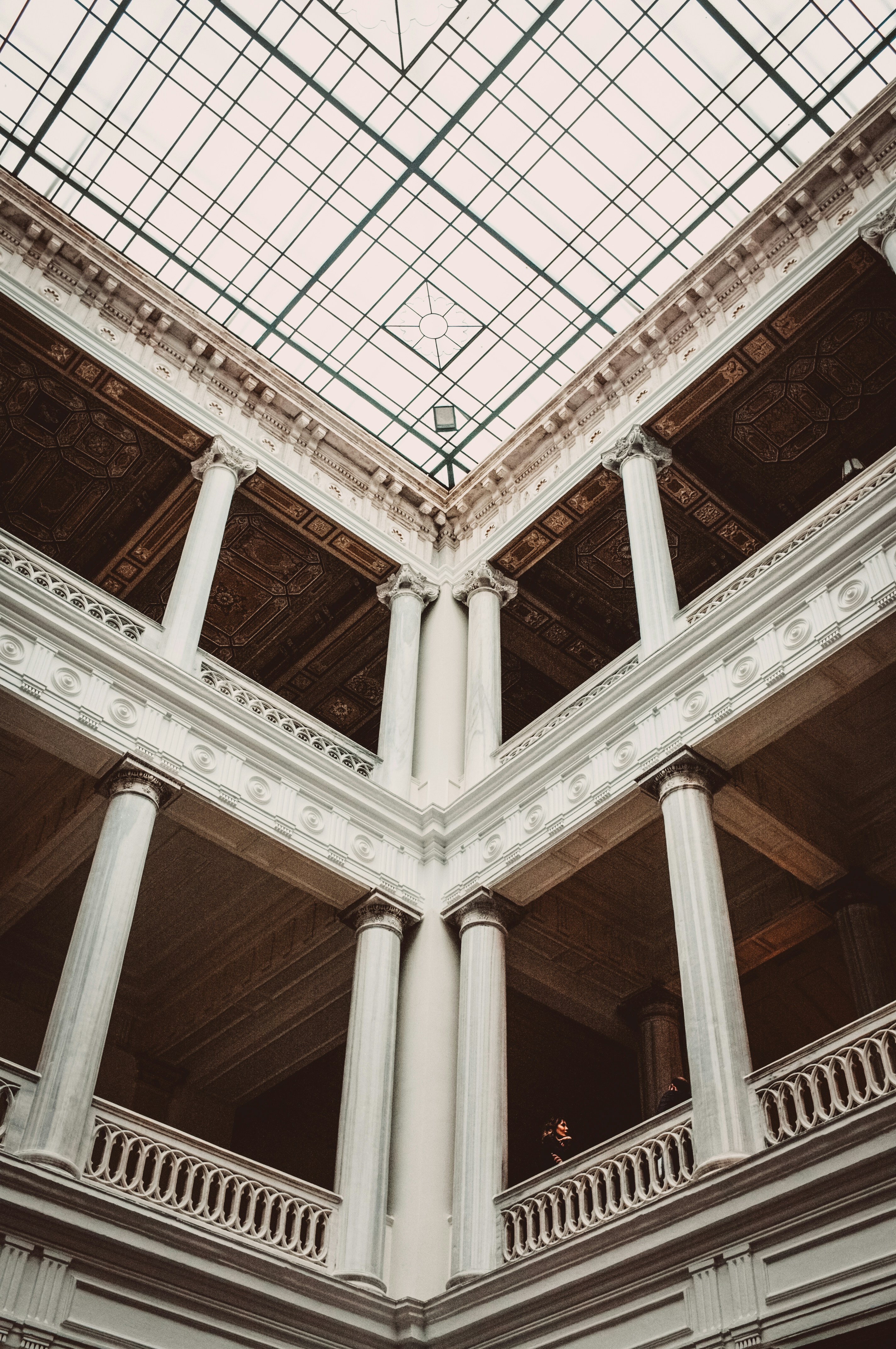 The ceiling of a building with a glass roof