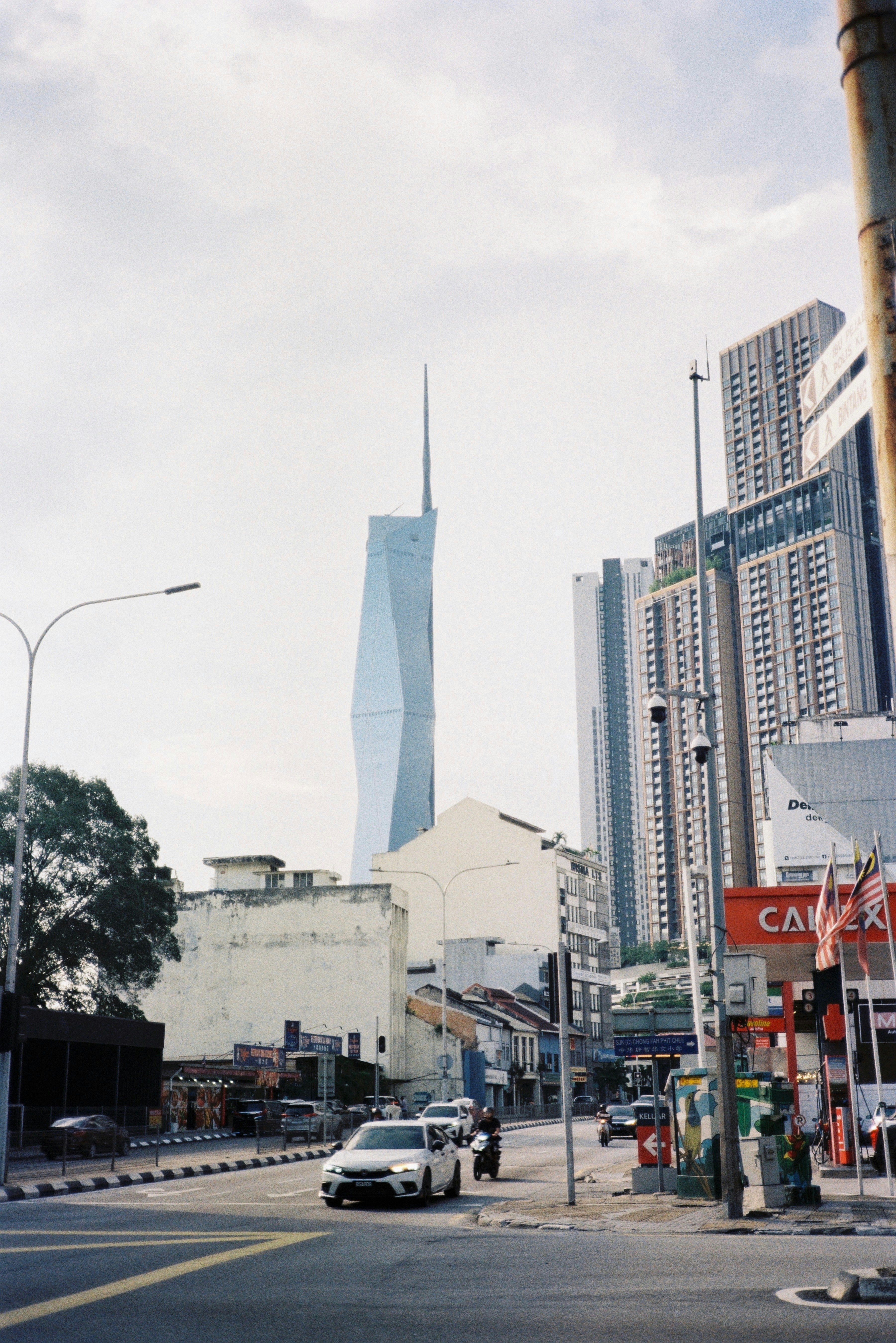 A city street with tall buildings in the background photo – Free Car ...