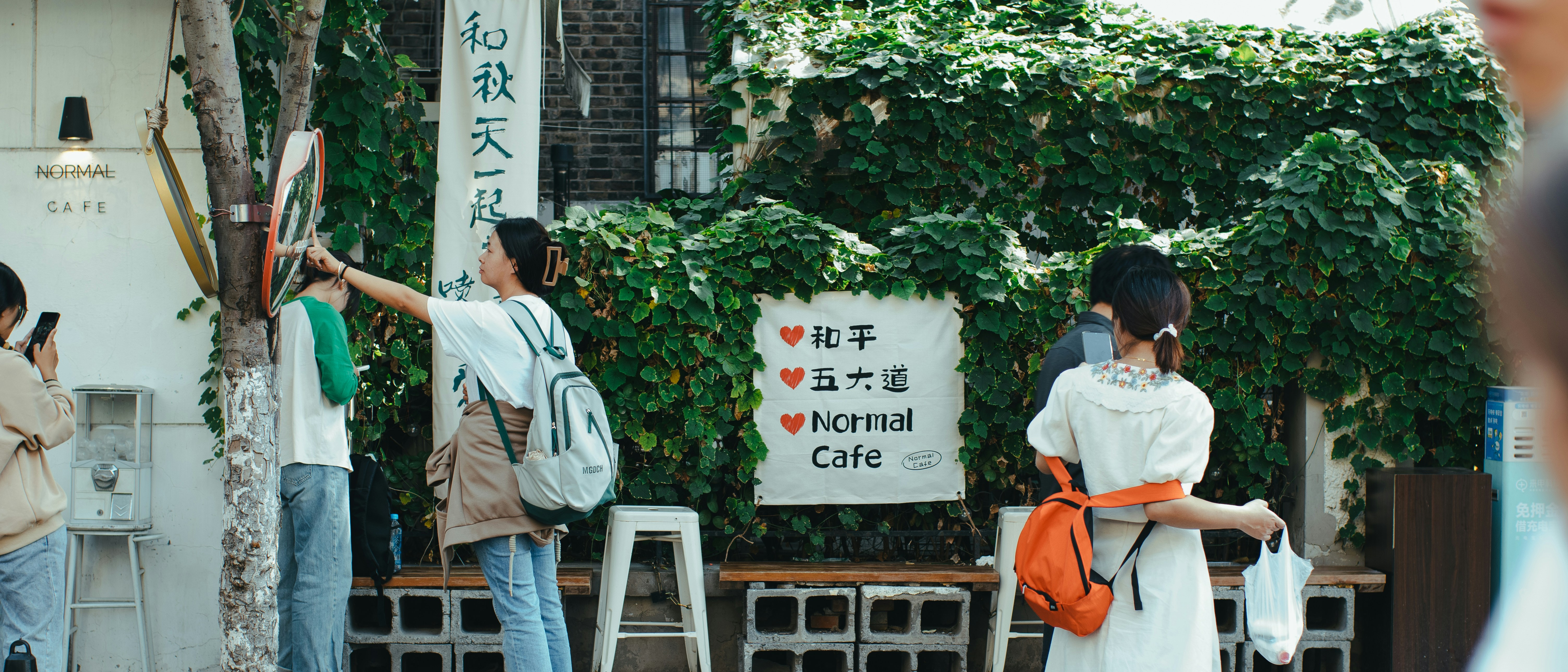 A group of people standing in front of a building
