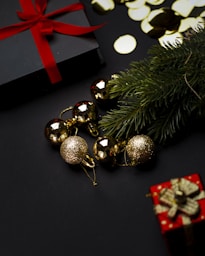 A christmas tree with presents and a red bow