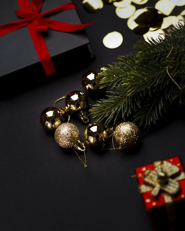 A christmas tree with presents and a red bow