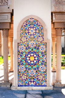 A colorful tile door in the middle of a building