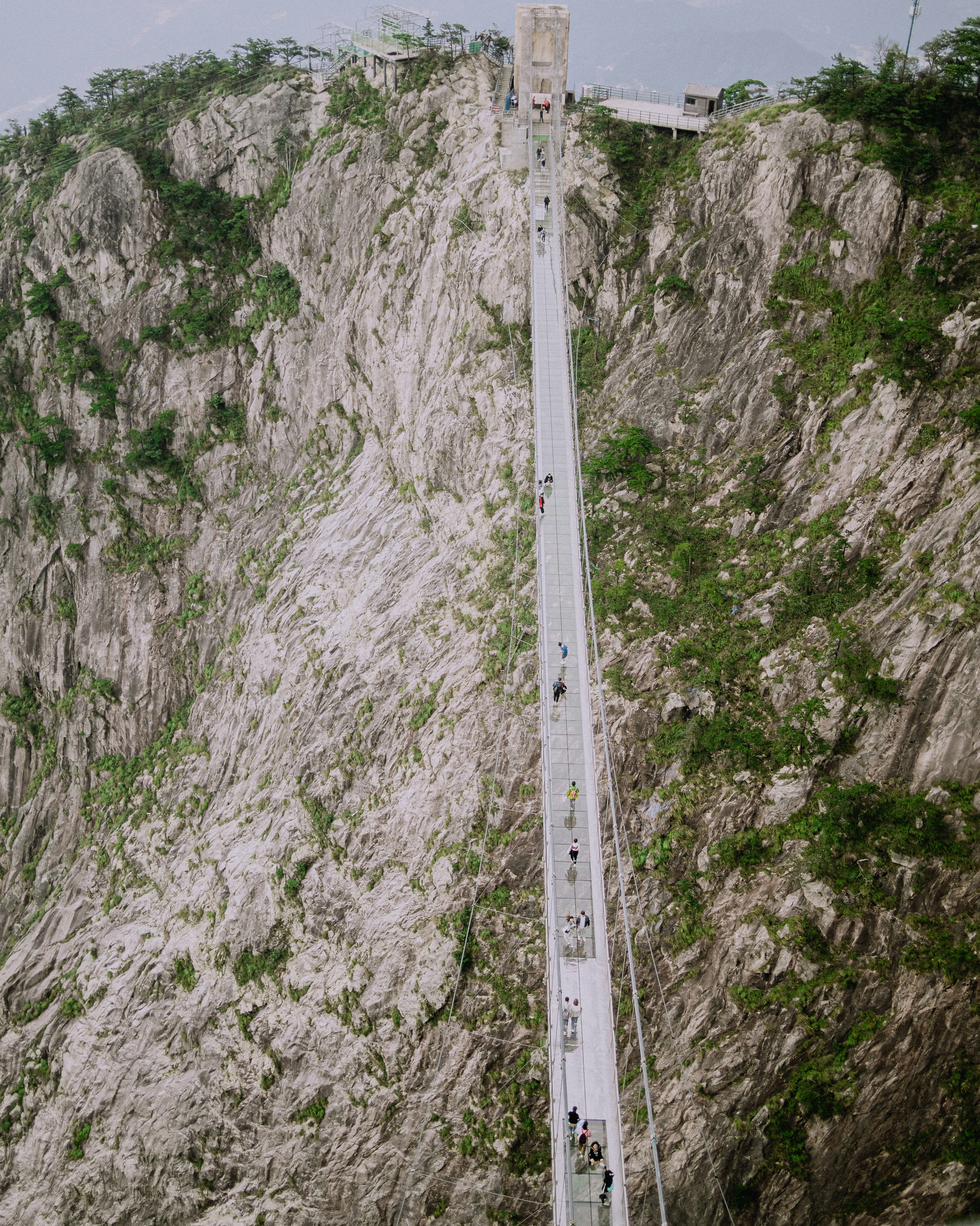 A boat is sailing on the water near a mountain