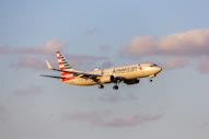 A large passenger jet flying through a blue sky