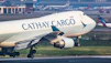A cathay cargo jet taking off from an airport runway