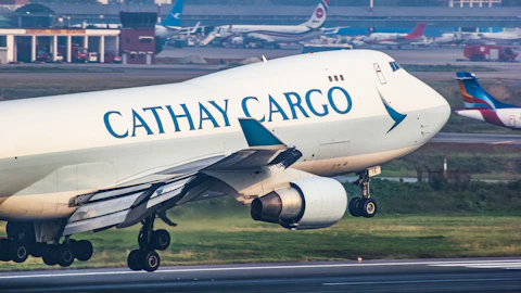 A cathay cargo jet taking off from an airport runway