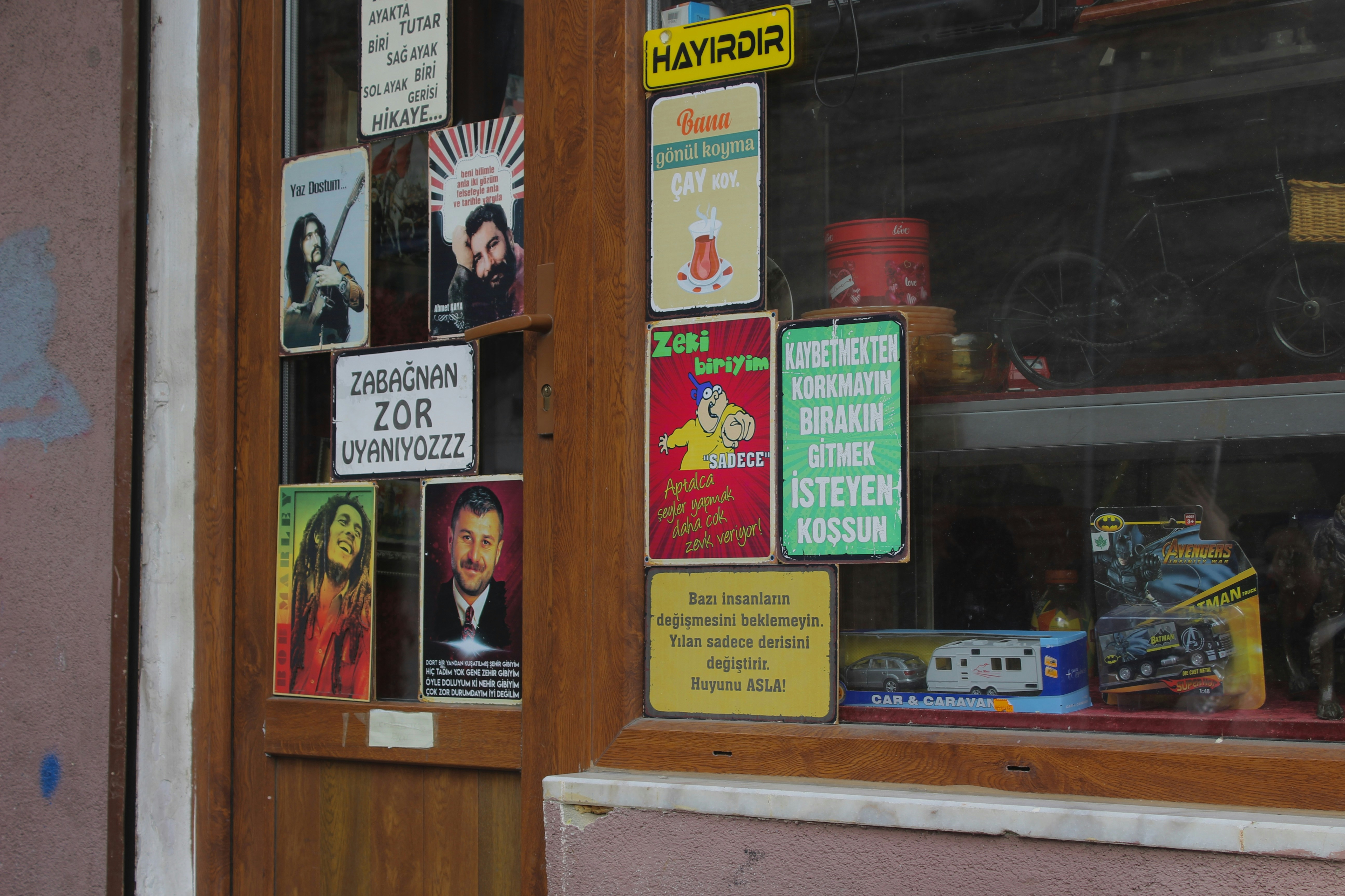 A store front with a lot of signs on it