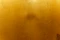 A close up of a toilet with a yellow wall