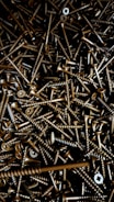 A large pile of screws and nuts