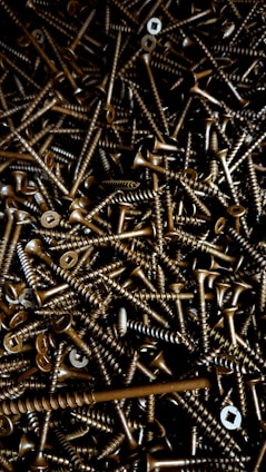 A large pile of screws and nuts