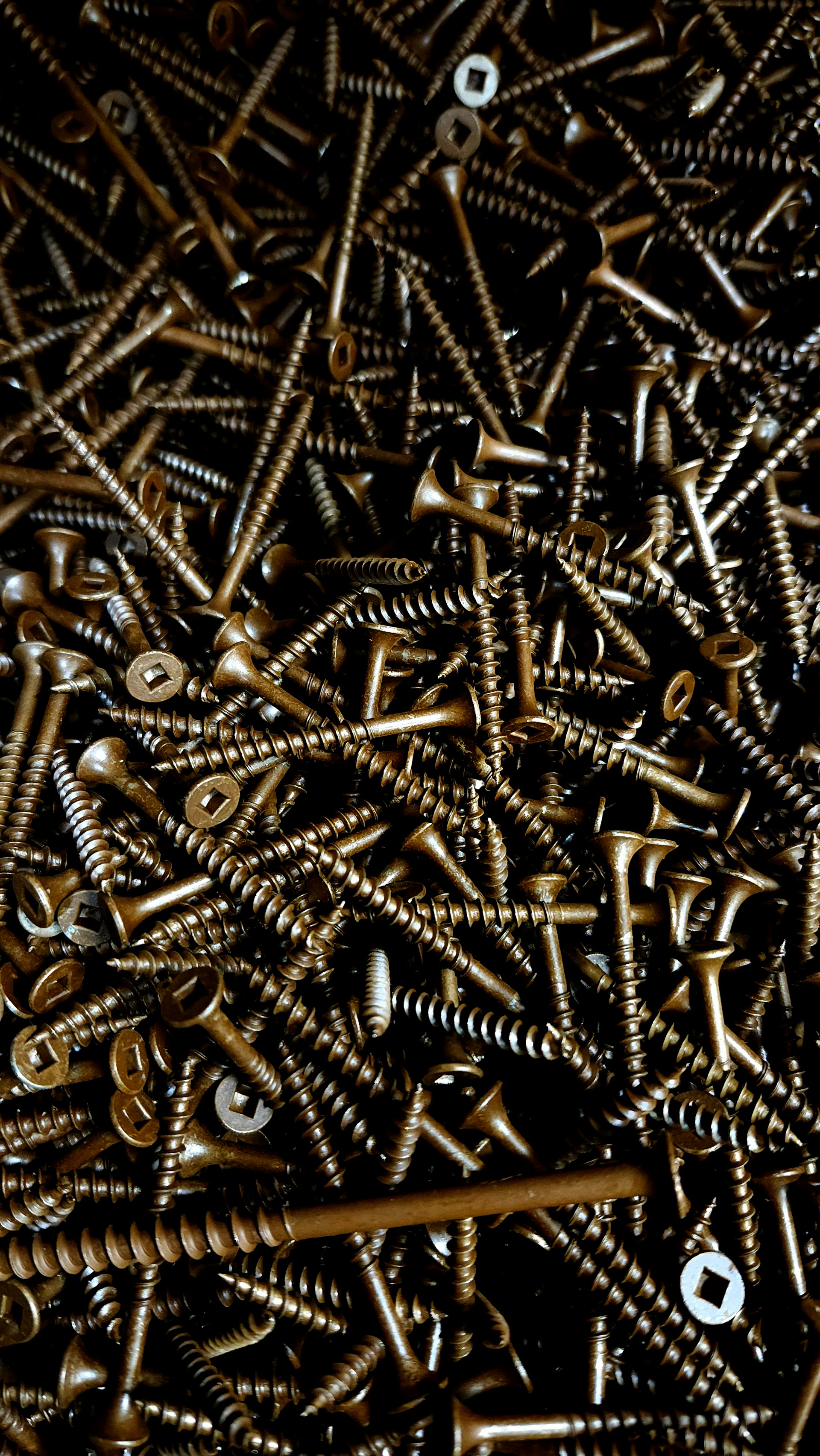 A large pile of screws and nuts