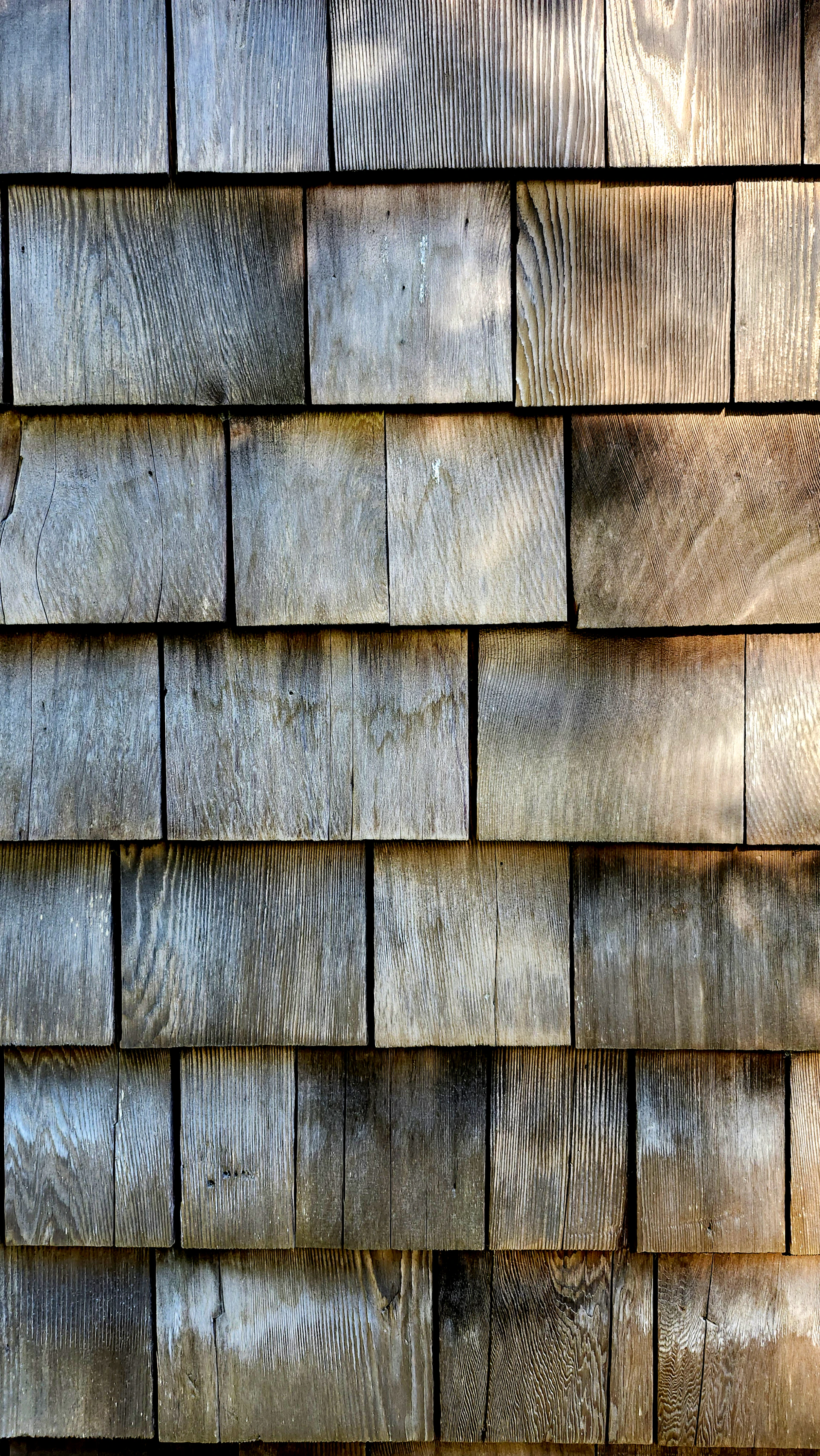 A close up of a wooden shingled roof