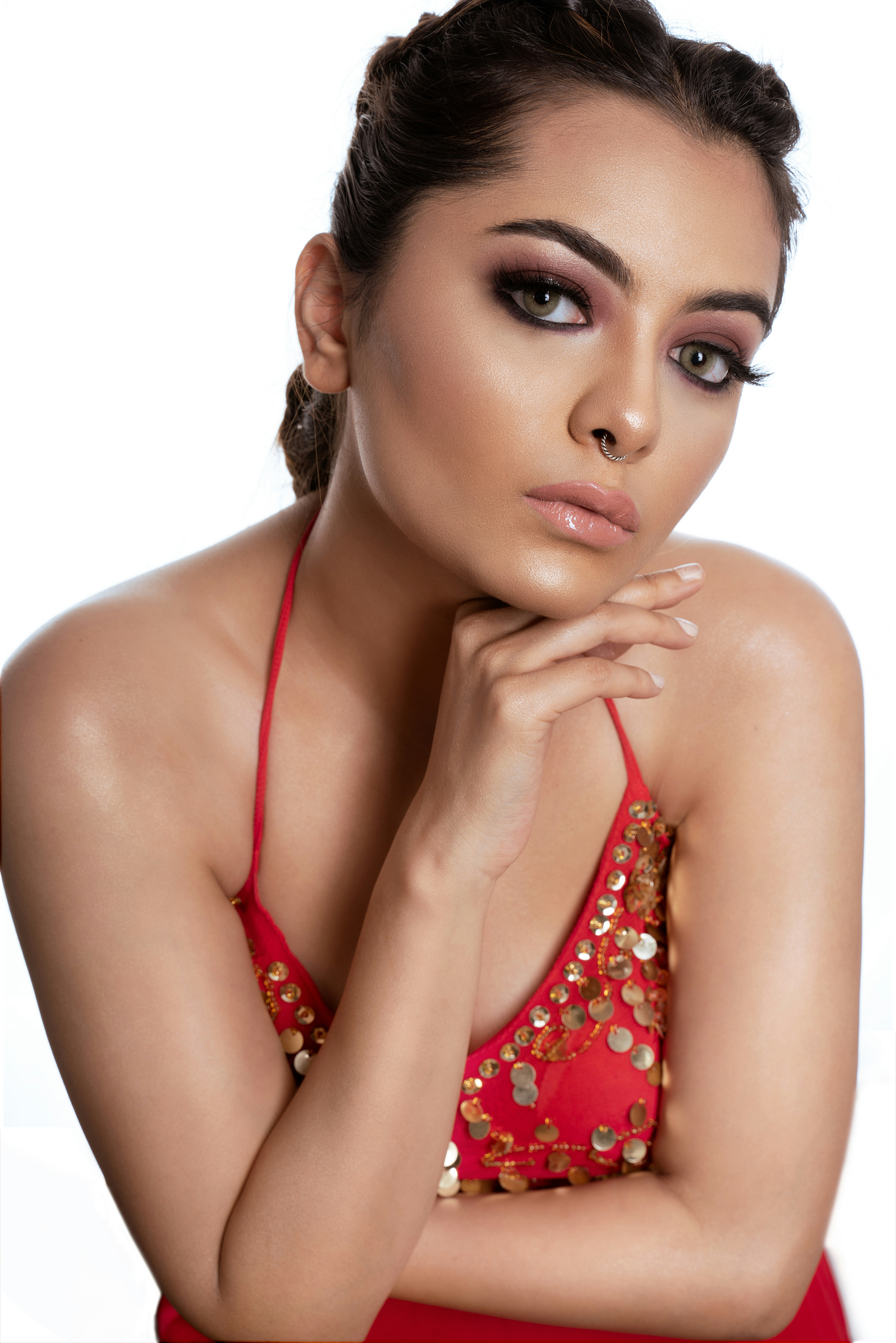 A woman in a red dress posing for a picture