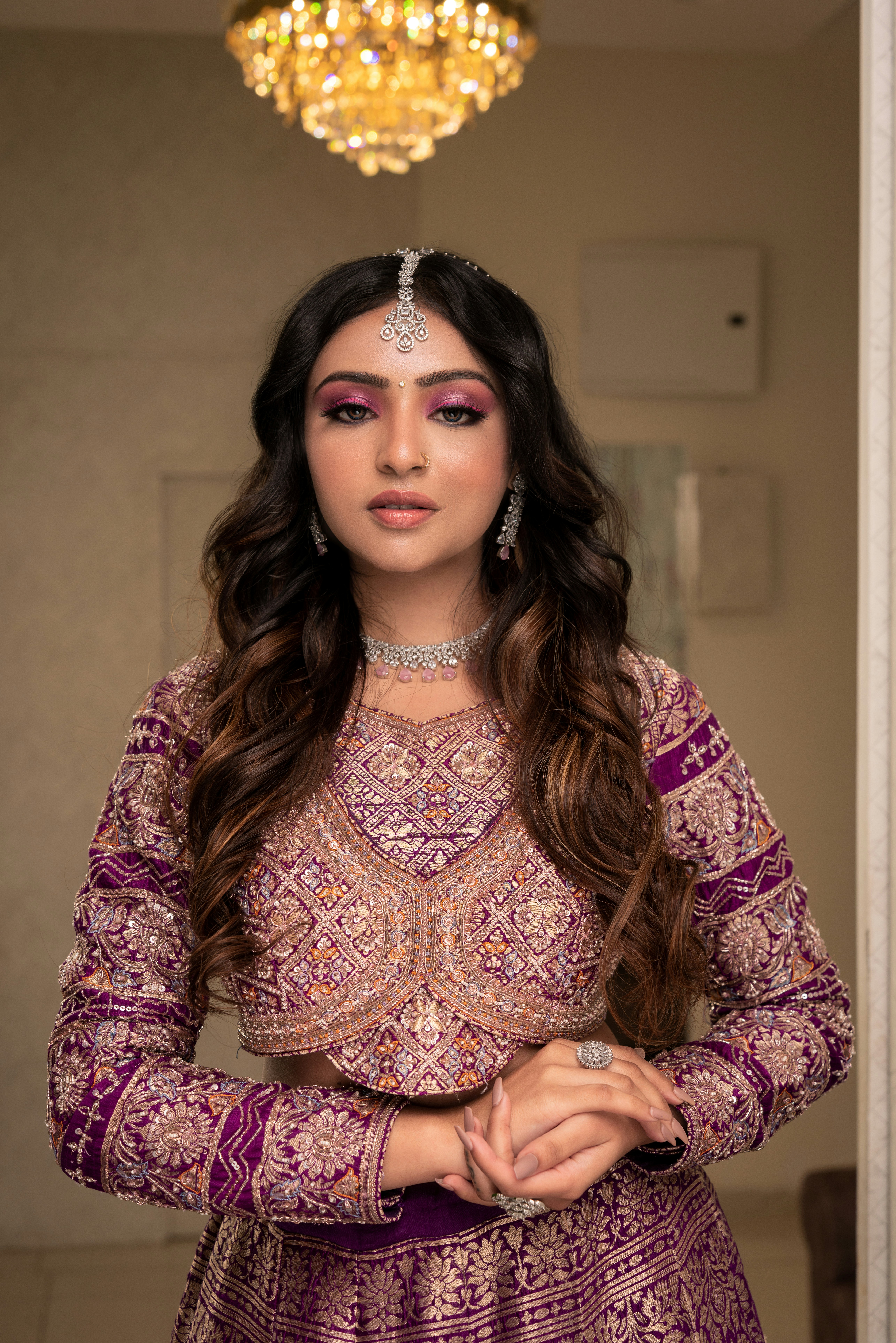 A woman in a purple dress standing in a doorway