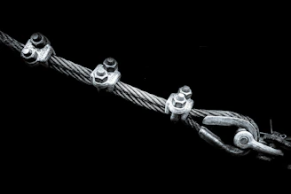 A group of metal objects on a black background