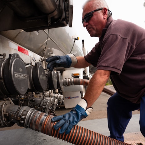 A man is working on a propane tank