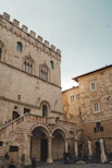 A stone building with a staircase leading up to it