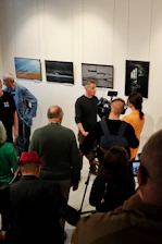 A group of people standing in a room