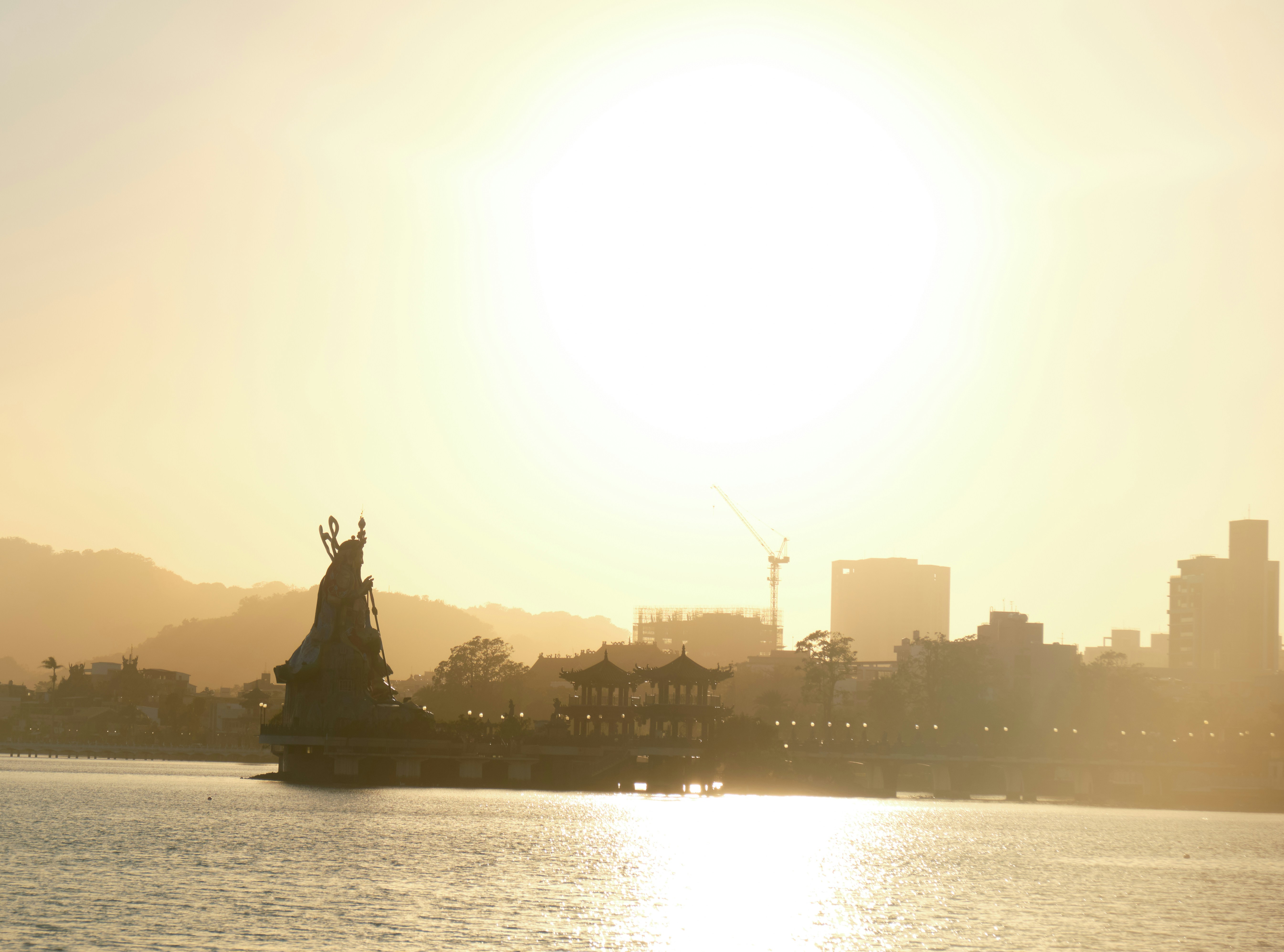 A large body of water with a city in the background