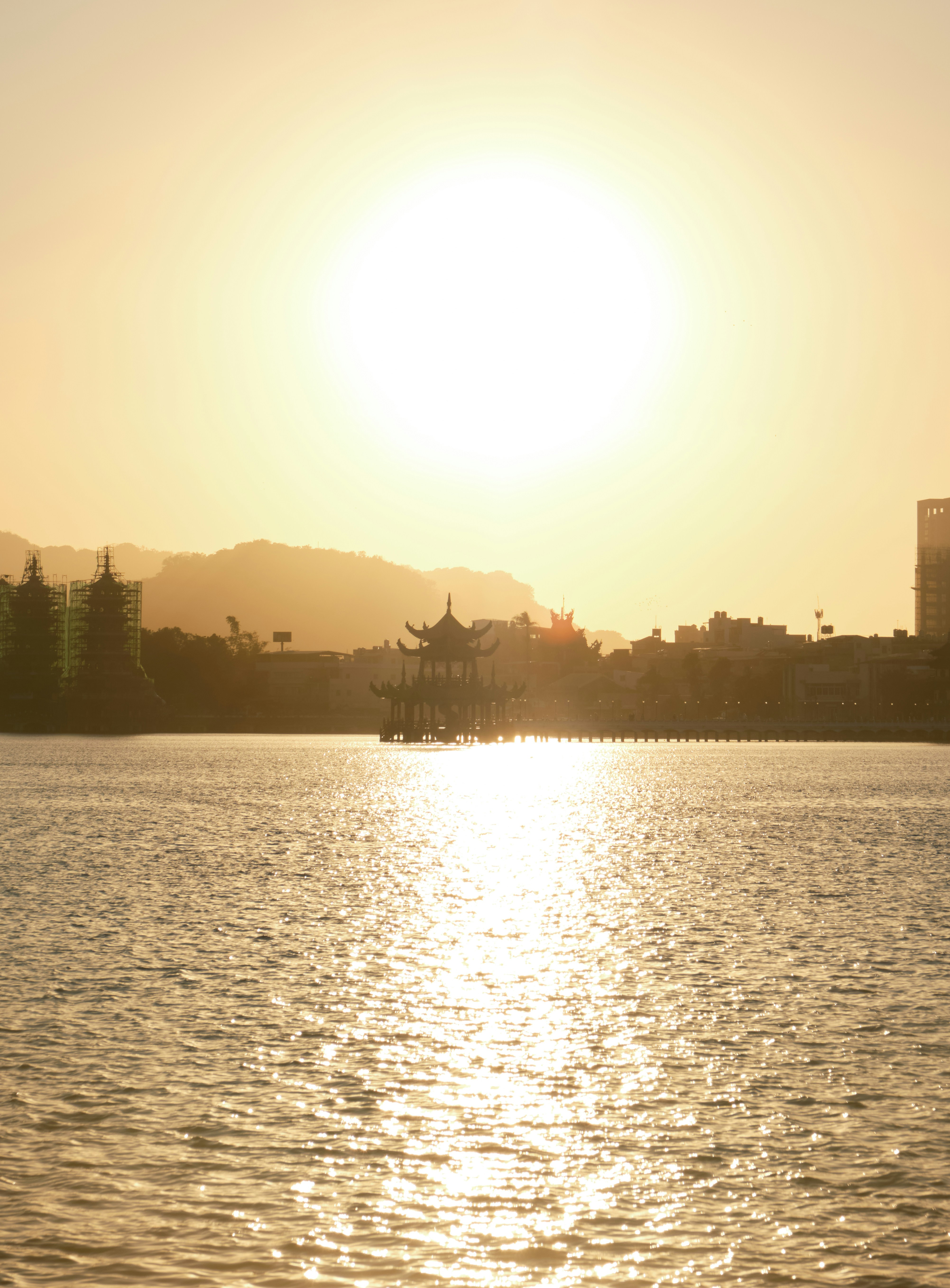 The sun is setting over a body of water