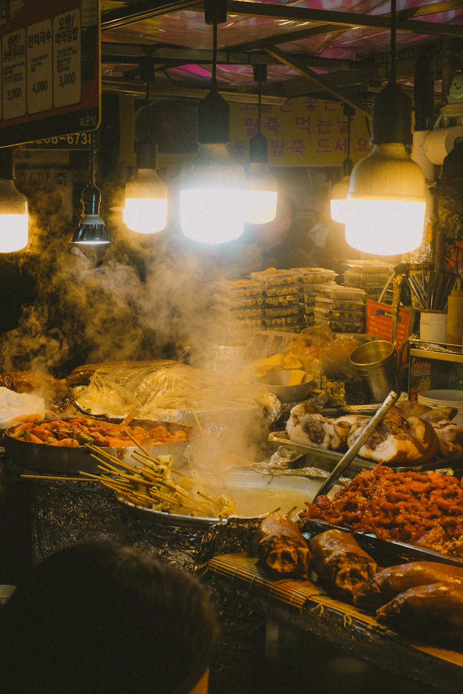 A street-food stand piled with fried snacks