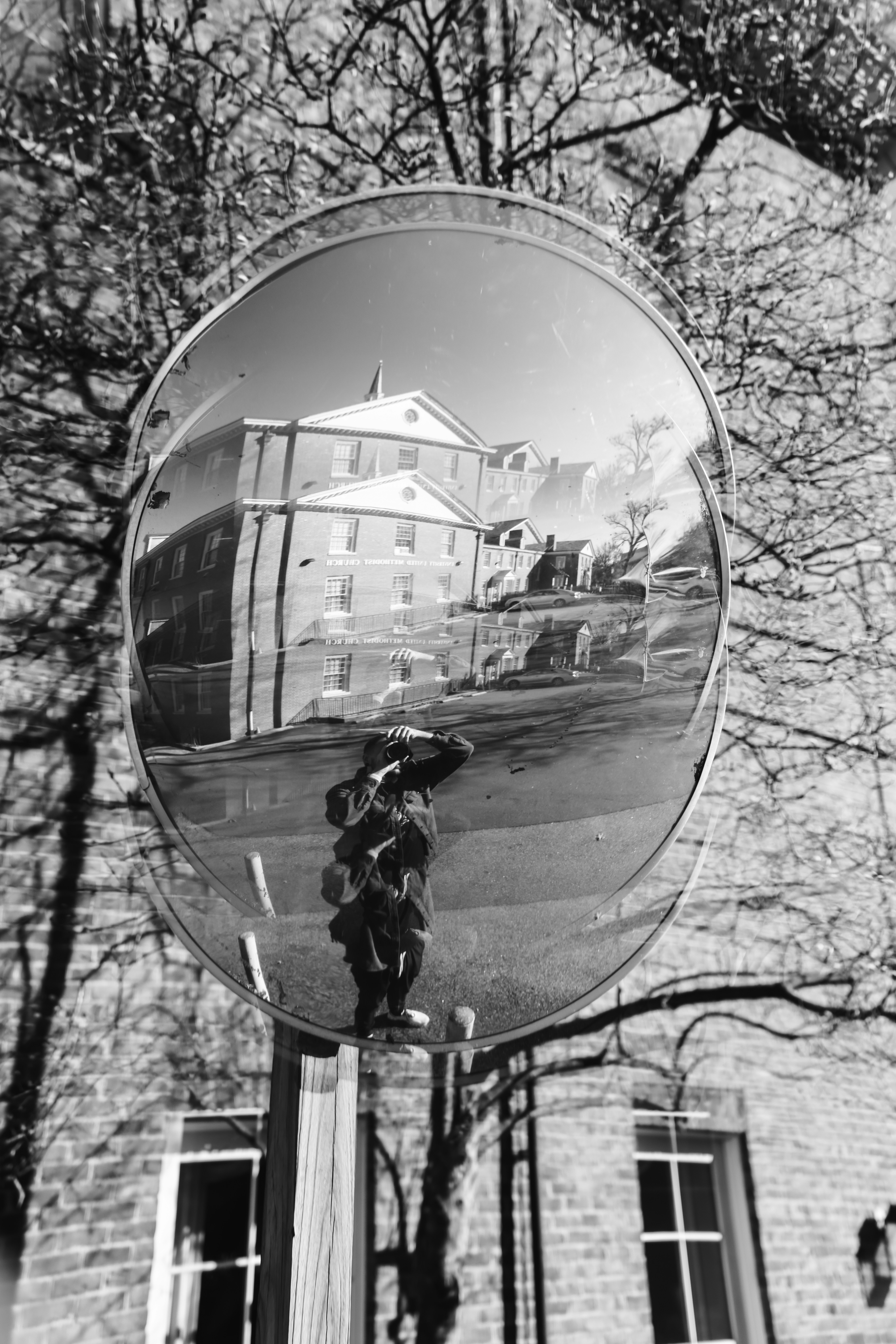 A reflection of a building in a mirror
