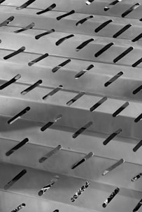 A close up of a metal object with holes in it