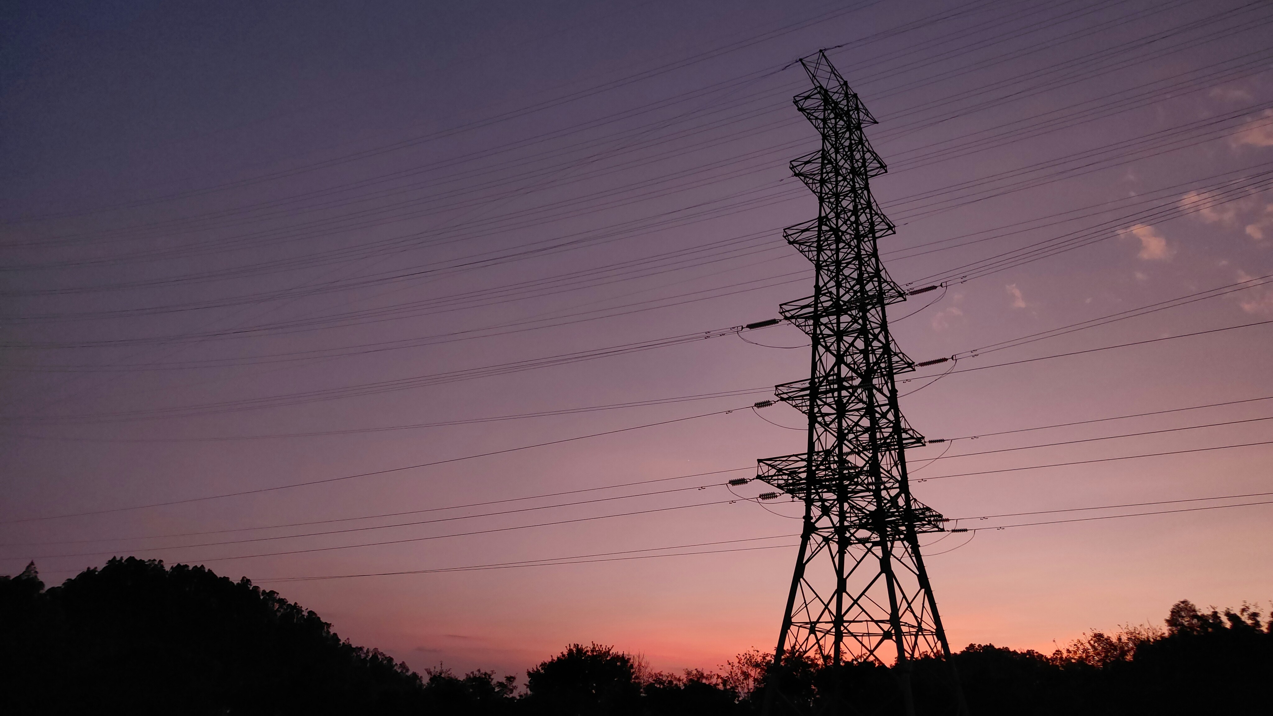 A tall tower sitting in the middle of a field