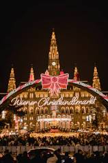 A large building with a christmas light display in front of it