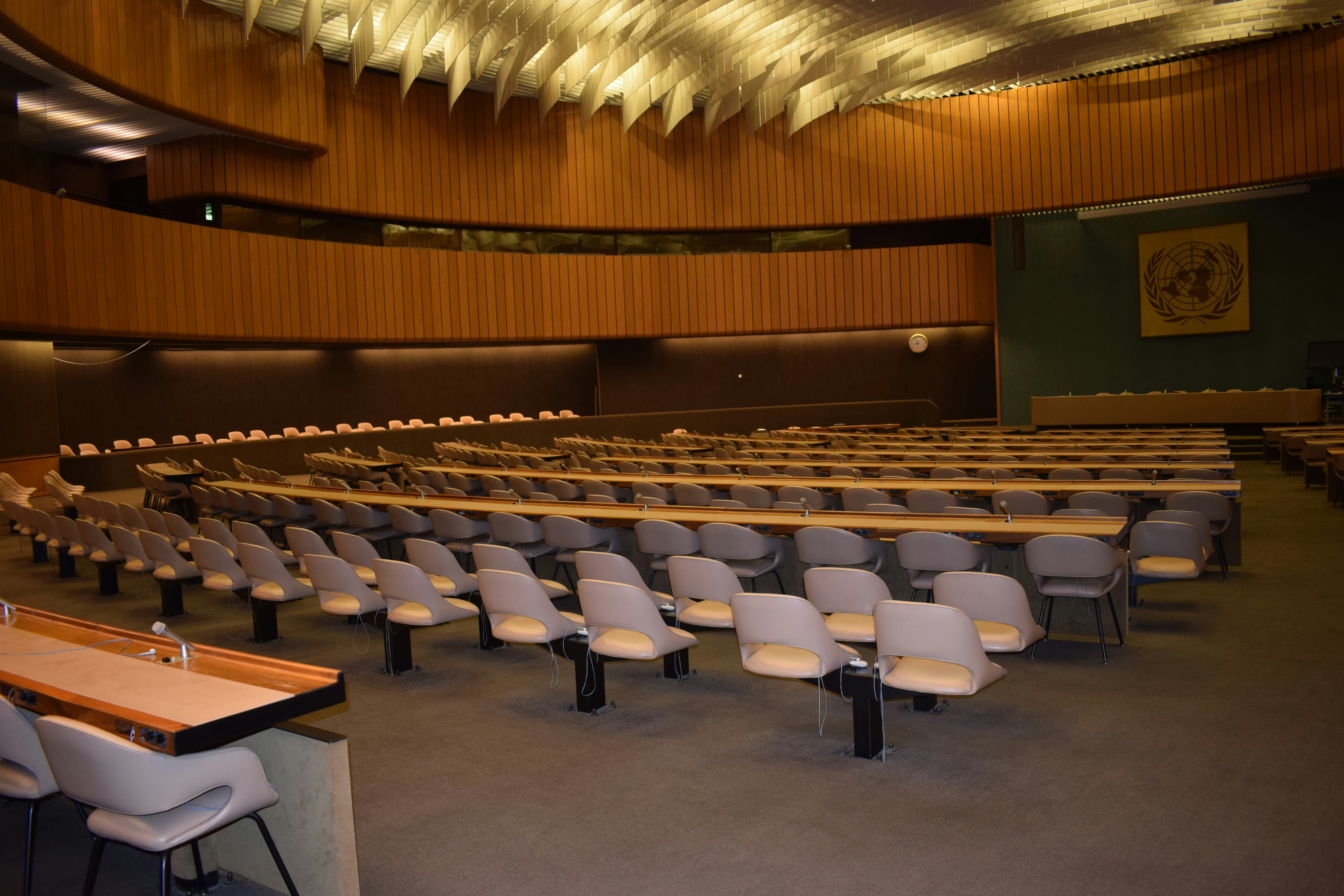 United Nations assembly hall with delegates in session representing diplomatic excellence and righteousness