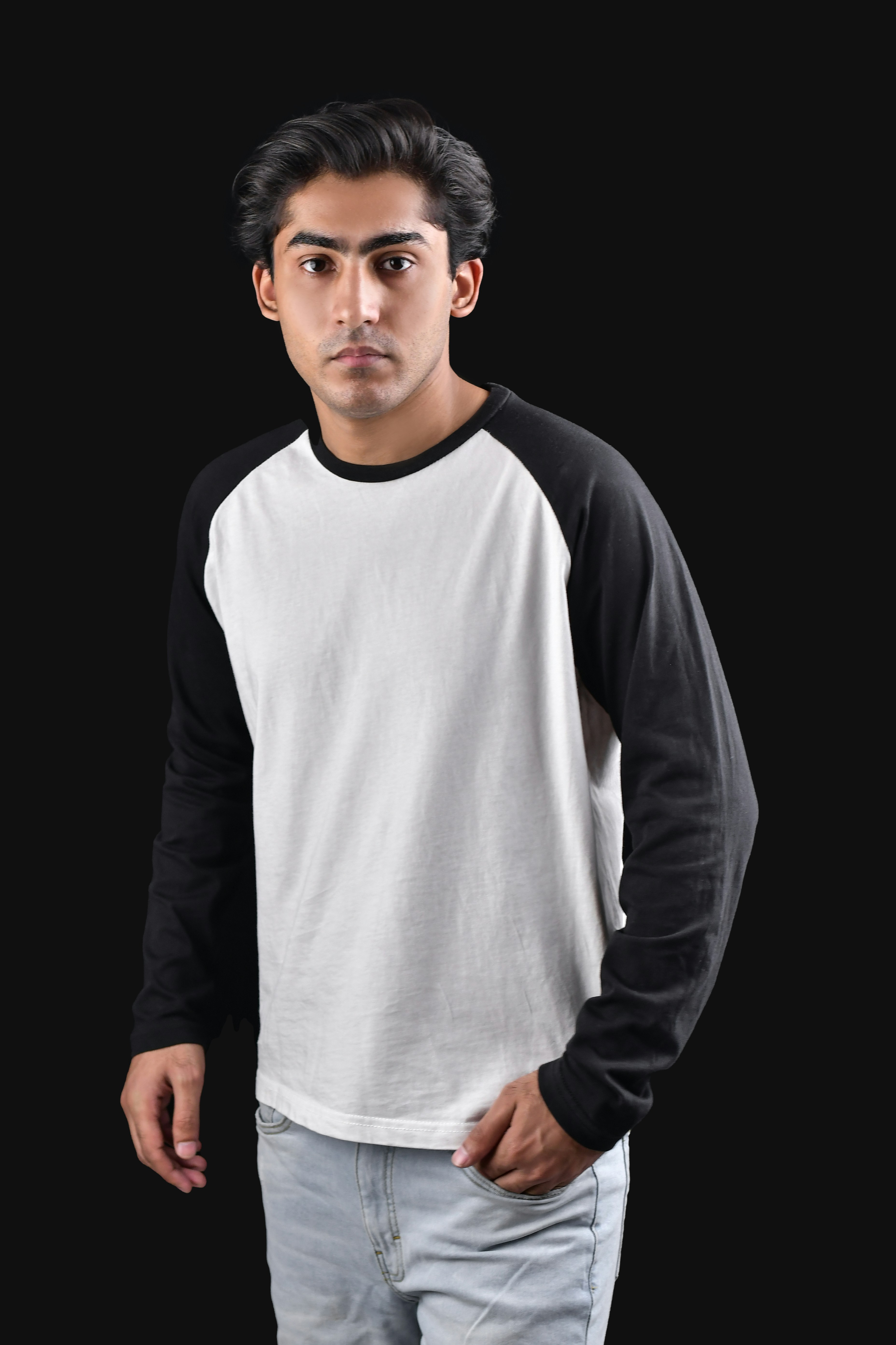 A man standing with his hands in his pockets