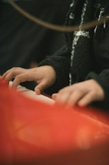 A close up of a person playing a musical instrument
