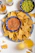 A plate of chips, salsa, and beer on a table