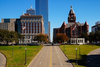 A city street with a clock tower in the background