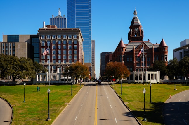 A city street with a clock tower in the background