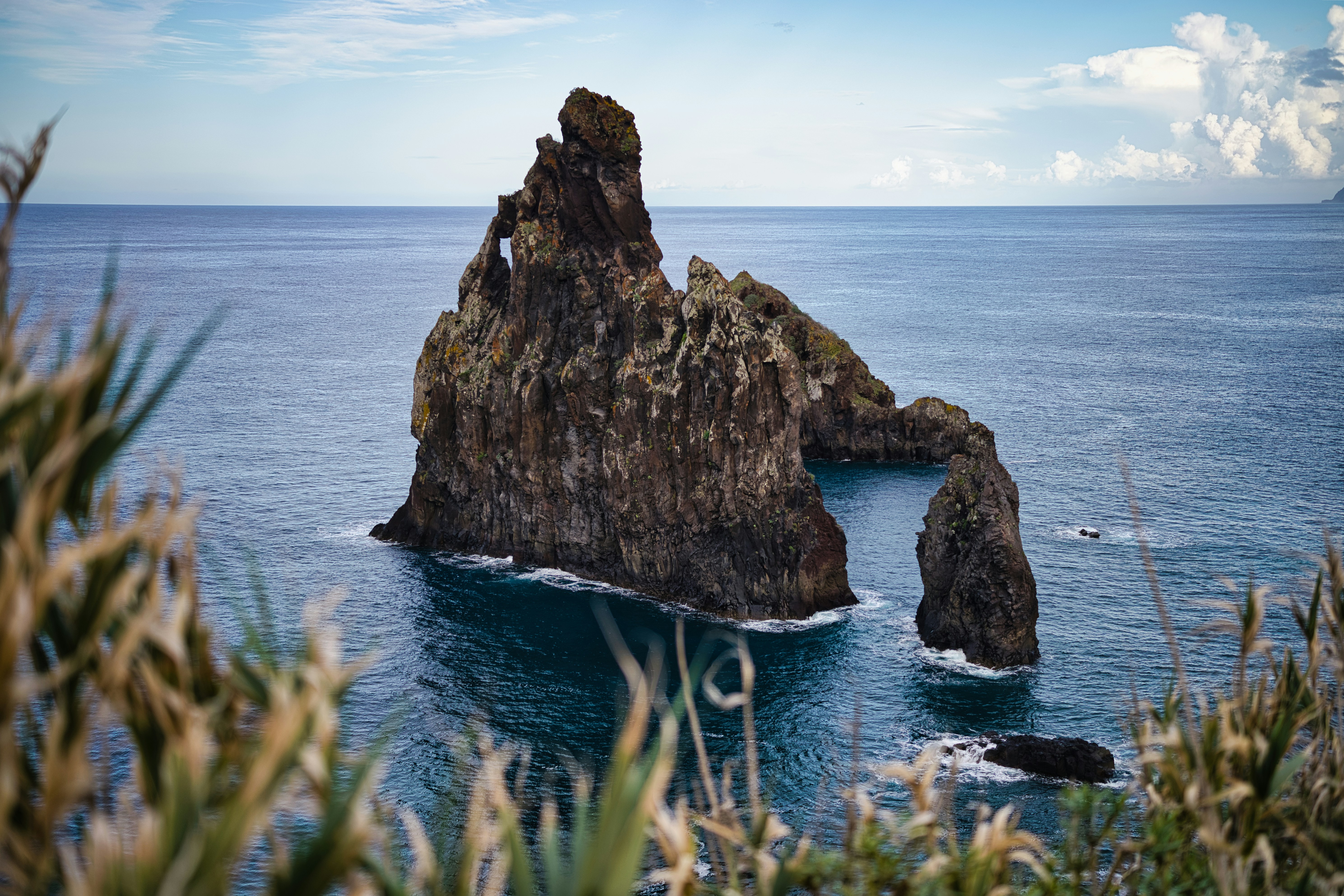 A rock outcropping in the middle of the ocean