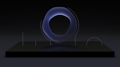 A blue object is on a black surface