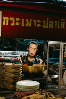 A man standing in front of a bowl of food