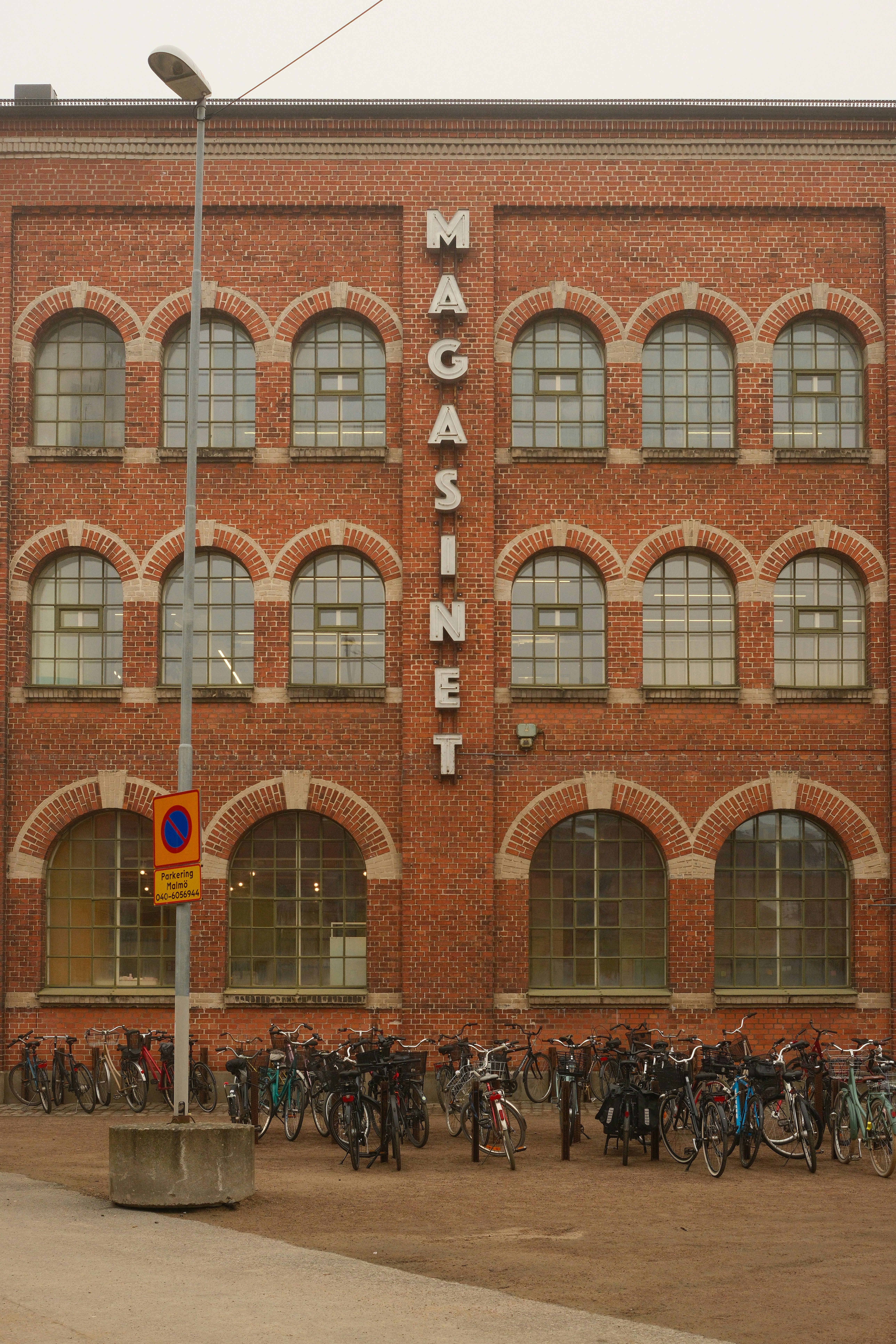 A group of people standing in front of a building