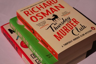 Three books stacked on top of each other