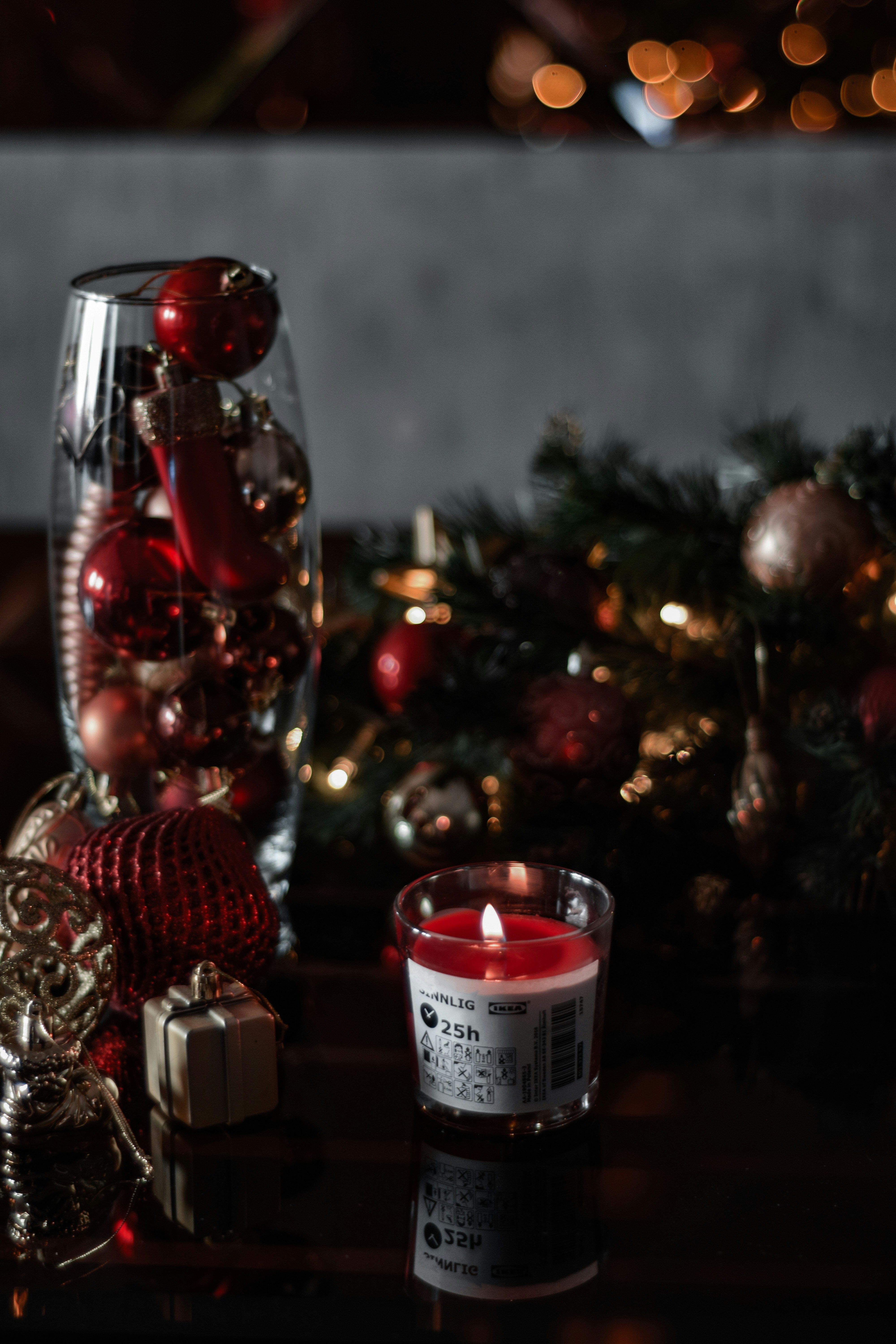 A candle and some ornaments on a table