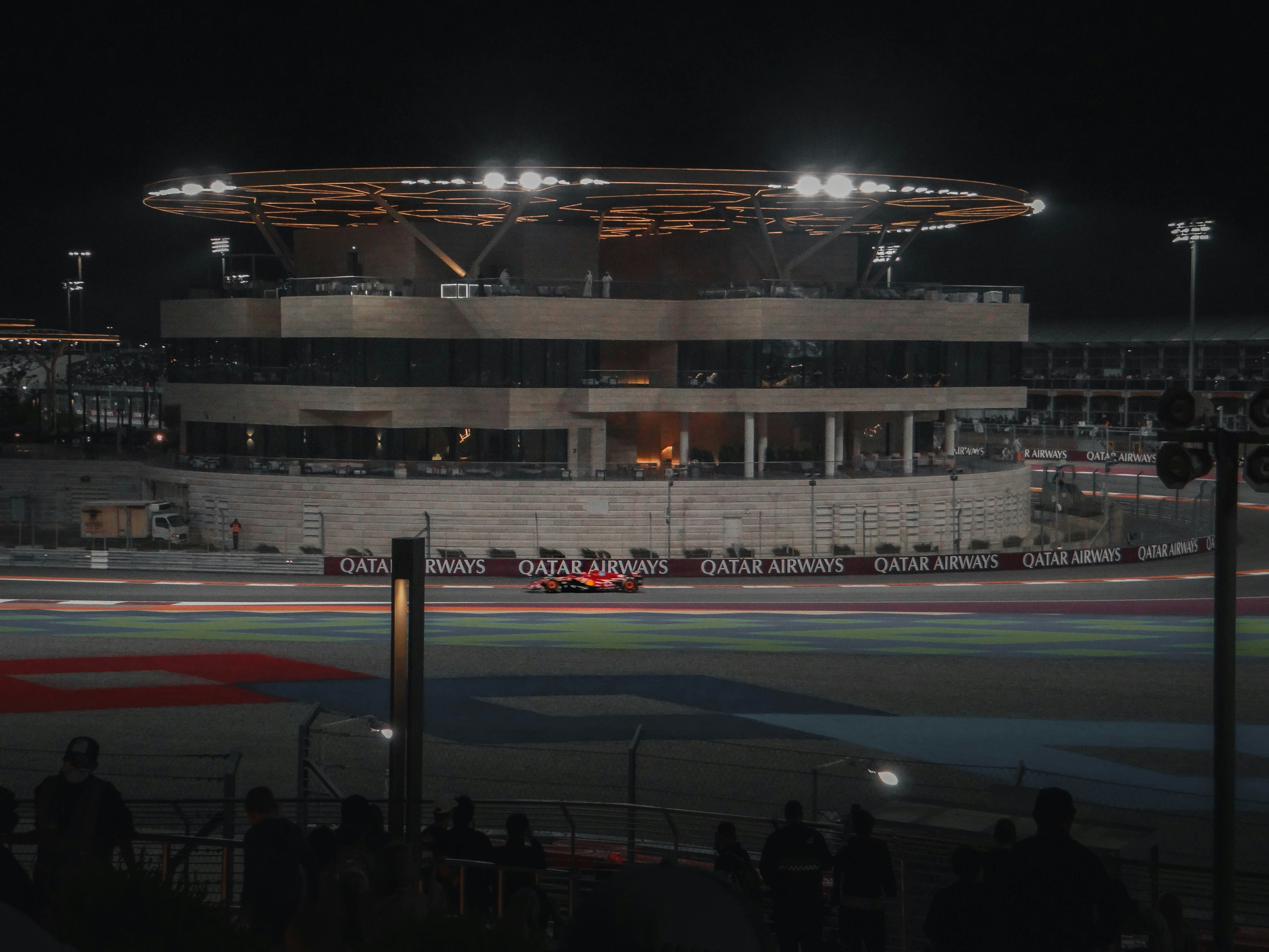 Race venue lights at night, representing Formula 1 championship atmosphere