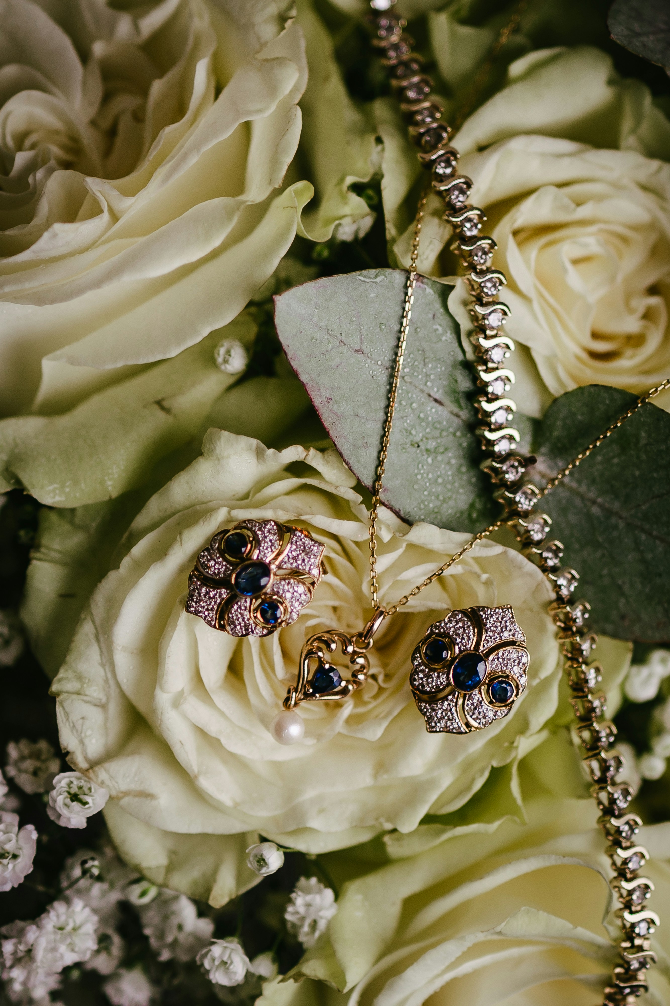 A bouquet of flowers with a necklace on it