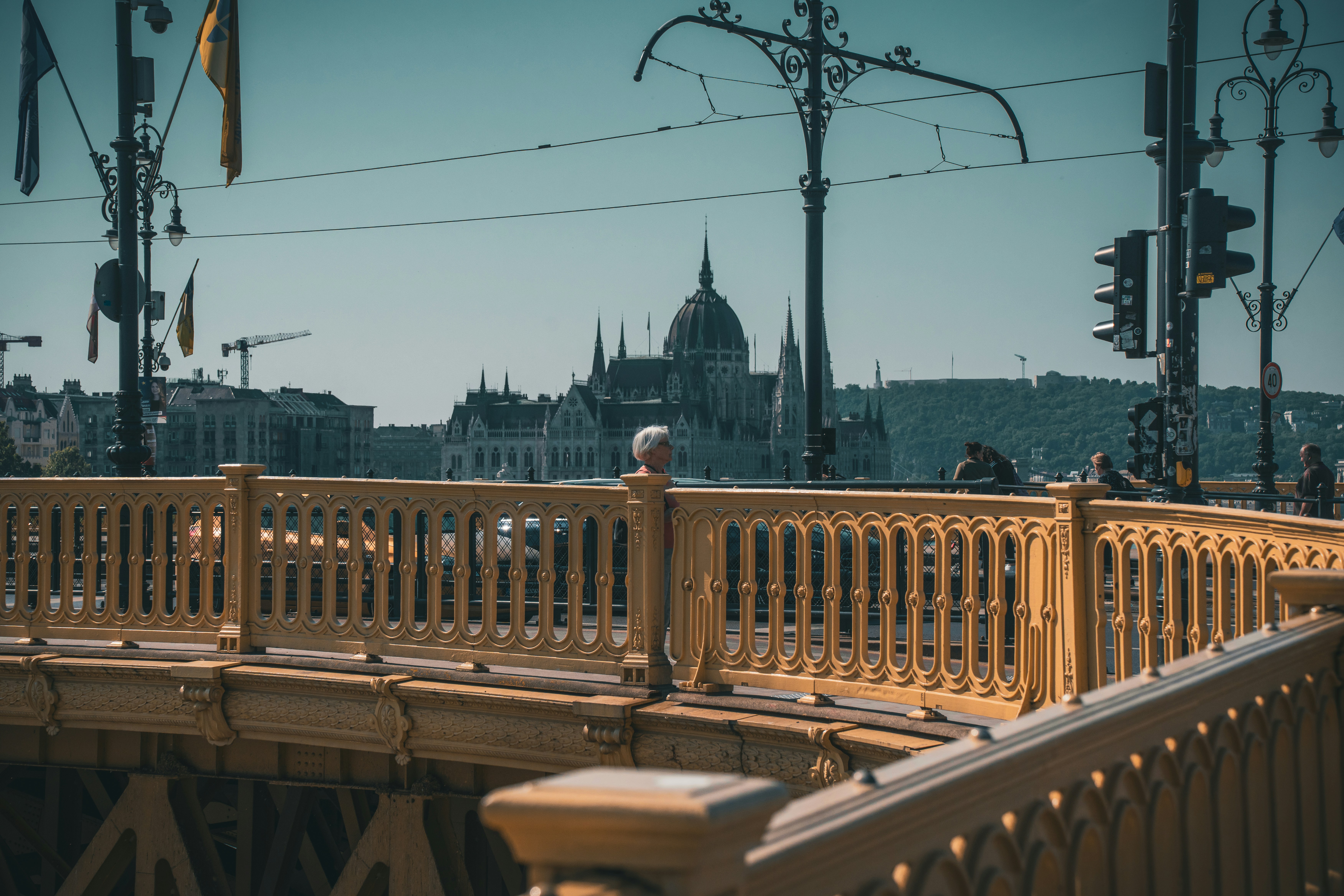 A wooden bridge with a view of a city in the background