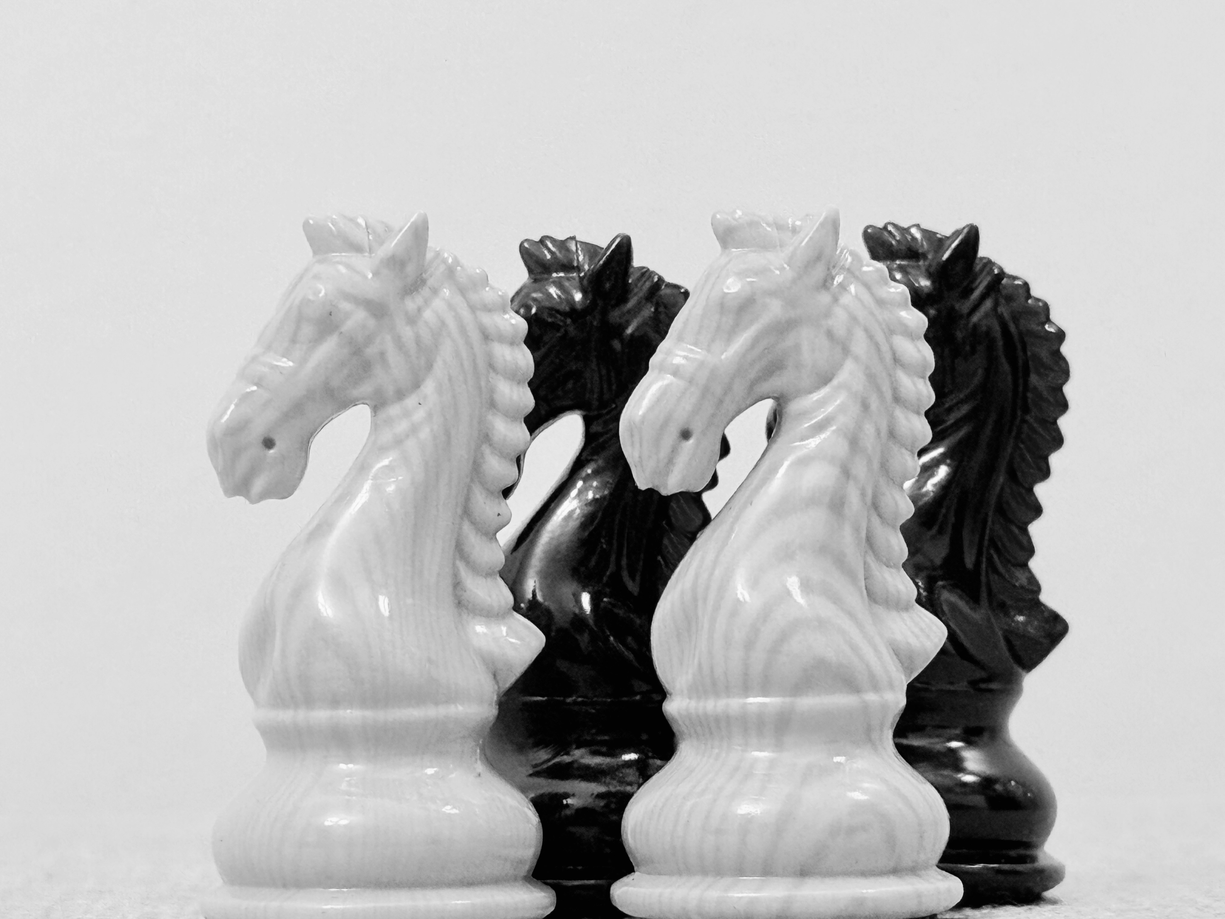 A couple of black and white chess pieces