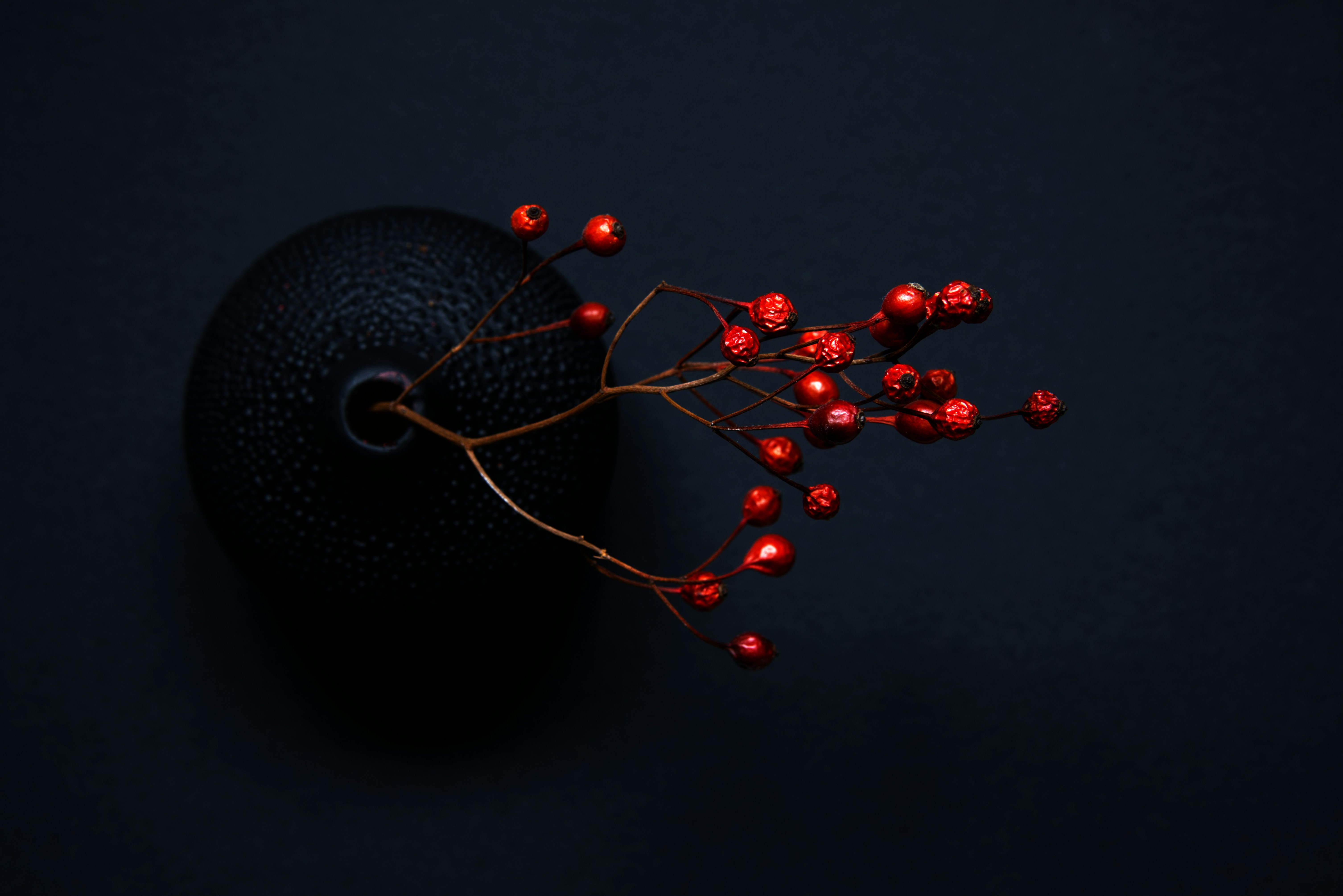 A stunning shot of the cherry blossoms in full bloom along the Seoul Cheonggyecheon Stream, with people taking photos and enjoying the spring atmosphere.