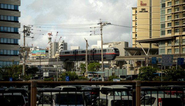 A group of buses parked next to each other in a parking lot — Okinawa, Japan